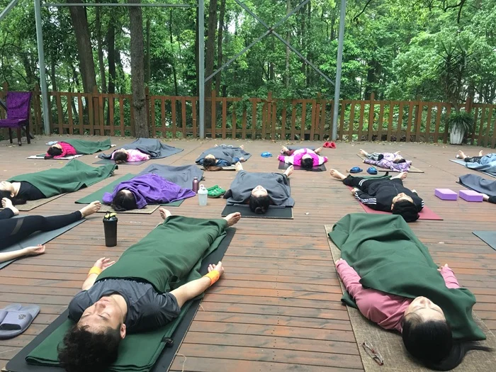 Yoga Retreat Students in Savasana During Yoga Class at Antaranga Yoga School